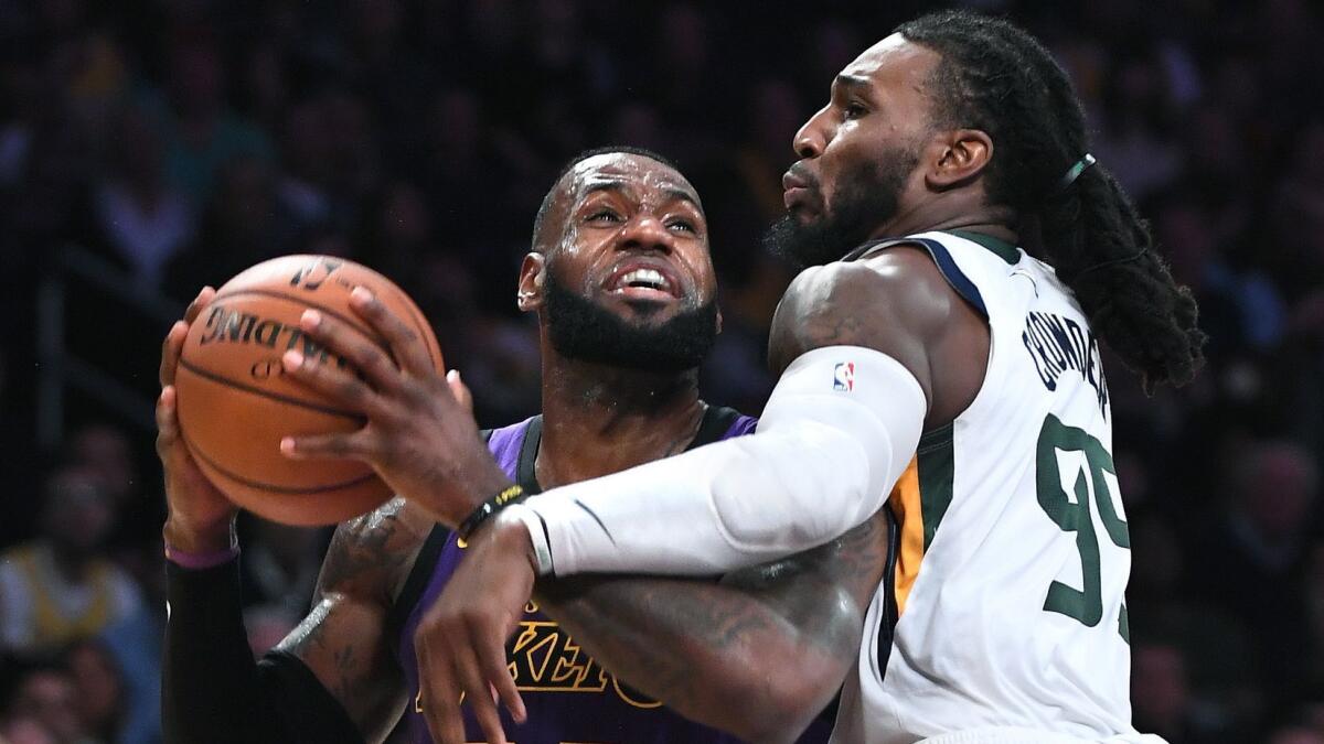 Lakers' LeBron James drives on Jazz's Jae Crowder.