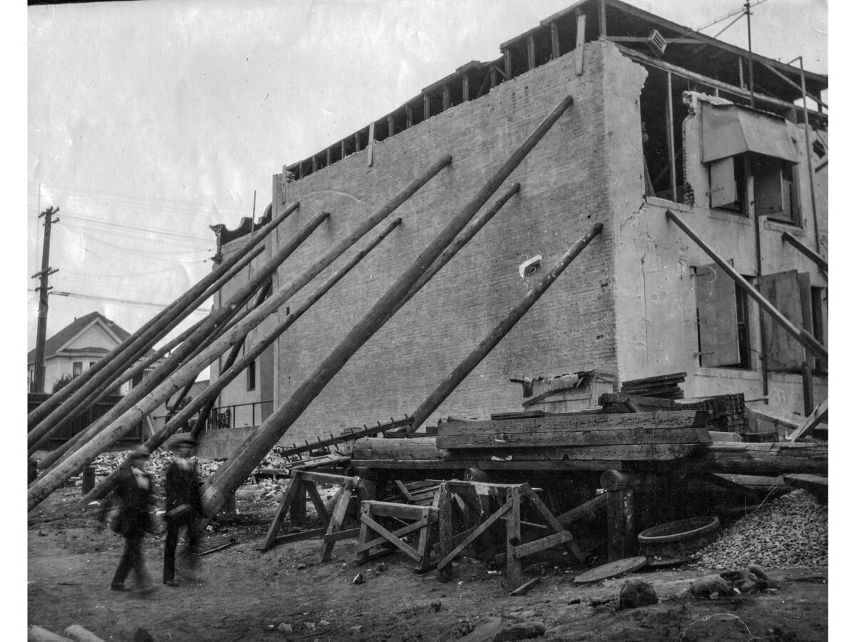 June 30, 1928: Telephone poles placed to brace the Southern California Telephone Building in Santa Barbara after earthquake.
