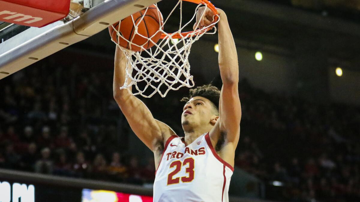 USC freshman forward Max Agbonkpolo throws down a slam dunk in the first half against Long Beach State at the Galen Center on Dec. 15, 2019.