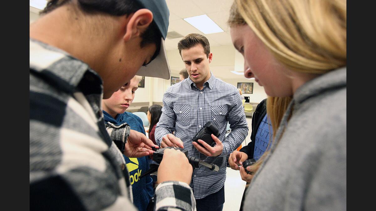 Class instructor Kevin DeSimone helps the broadcast team of Tyler Scribner, 14, George Kamar, 13, Jayden Husfeld, 14, and Lucas Lorenzana, 14, to put their camera setup together in the brand new LCTV, La Cañada High School's new communications, broadcasting and production center on Tuesday, January 17, 2017.