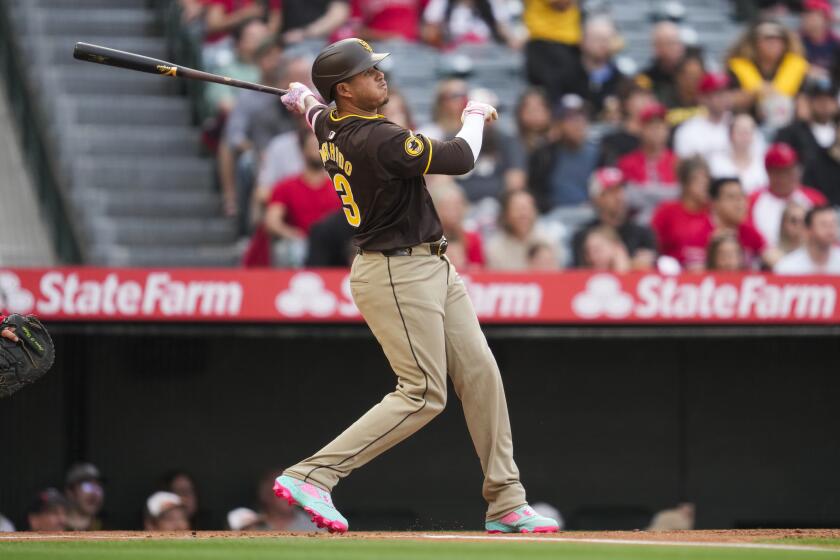 San Diego Padres' Manny Machado hits a home run during the first inning of a baseball game against the Los Angeles Angels in Anaheim, Calif., Monday, June 3, 2024. (AP Photo/Ashley Landis)