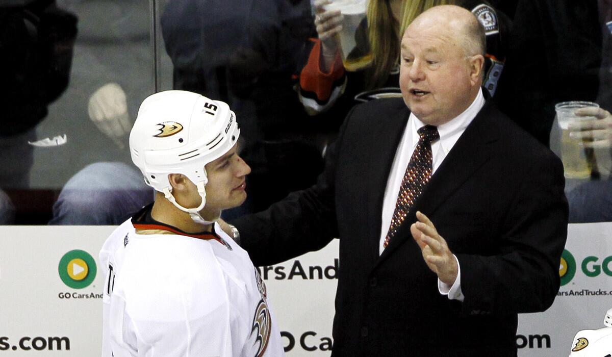 Ducks Coach Bruce Boudreau talks with captain Ryan Getzlaf during a game last season.