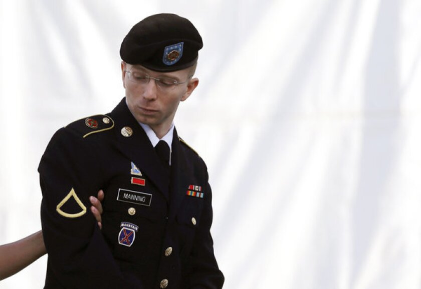 Army Pfc. Bradley Manning is escorted into a courthouse in Fort Meade, Md., on Wednesday.