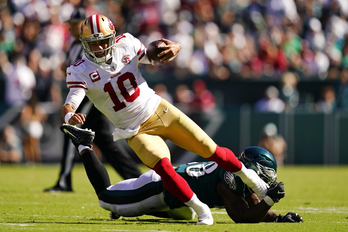 San Francisco 49ers quarterback Jimmy Garoppolo is stopped by Philadelphia Eagles linebacker Genard Avery.