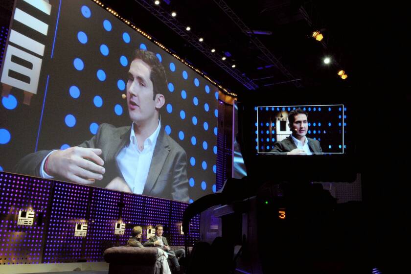 Instagram founder Kevin Systrom, seen above at a technology conference in France this month, tried to calm the uproar caused by the firm's new terms of service. “Instagram does not claim any ownership rights over your photos,” he wrote in a blog post Tuesday afternoon. “We respect that your photos are your photos. Period.”