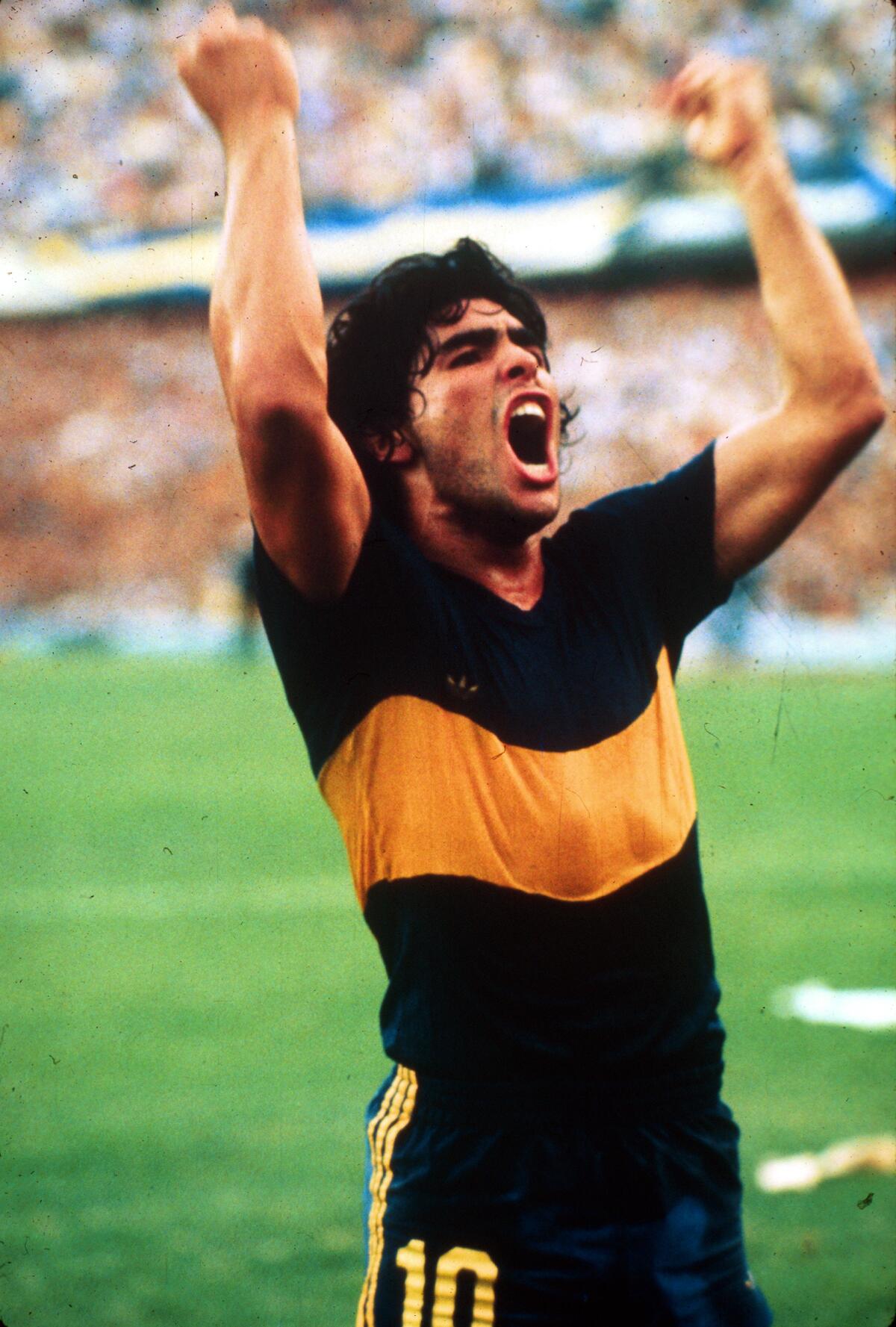 Diego Maradona celebrates a goal while playing with Boca Juniors in 1981.