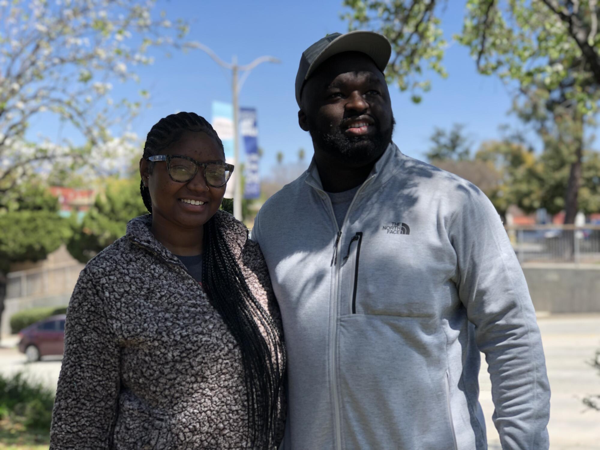  Paige Weathersby and Kevin Jones pose in the downtown area of  Pomona.