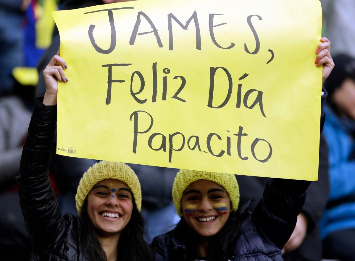Supporters of Colombia's national soccer team player James Rodriguez display a banner that reads in Spanish " James, happy day daddy" prior a Copa America Group C soccer match between Colombia and Peru at the Bicentenario German Becker stadium in Temuco, Chile, Sunday, June 21, 2015. The banner refers to the fathers' day celebration.(AP Photo/Ricardo Mazalan)