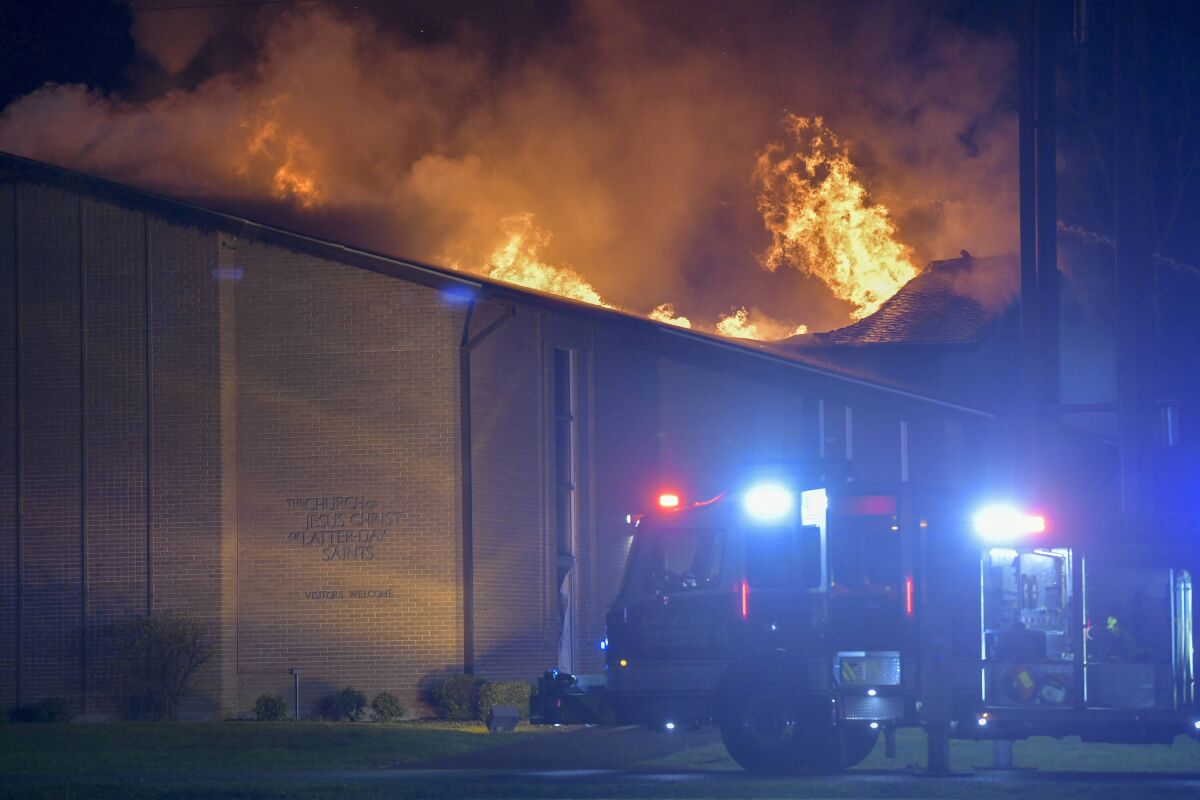 The Church of Jesus Christ of Latter Day Saints in Cape Girardeau, Mo., burns in a third alarm fire on Sunday, April 18, 2021. A man is now facing federal hate crime and arson charges for a fire that destroyed the Church of the Latter-day Saints in Cape Girardeau. The U.S. Department of Justice on Thursday, May 5, 2022, announced the charges against 46-year-old Christopher Scott Pritchard, of Cape Girardeau. (Sarah Yenesel/The Southeast Missourian via AP)