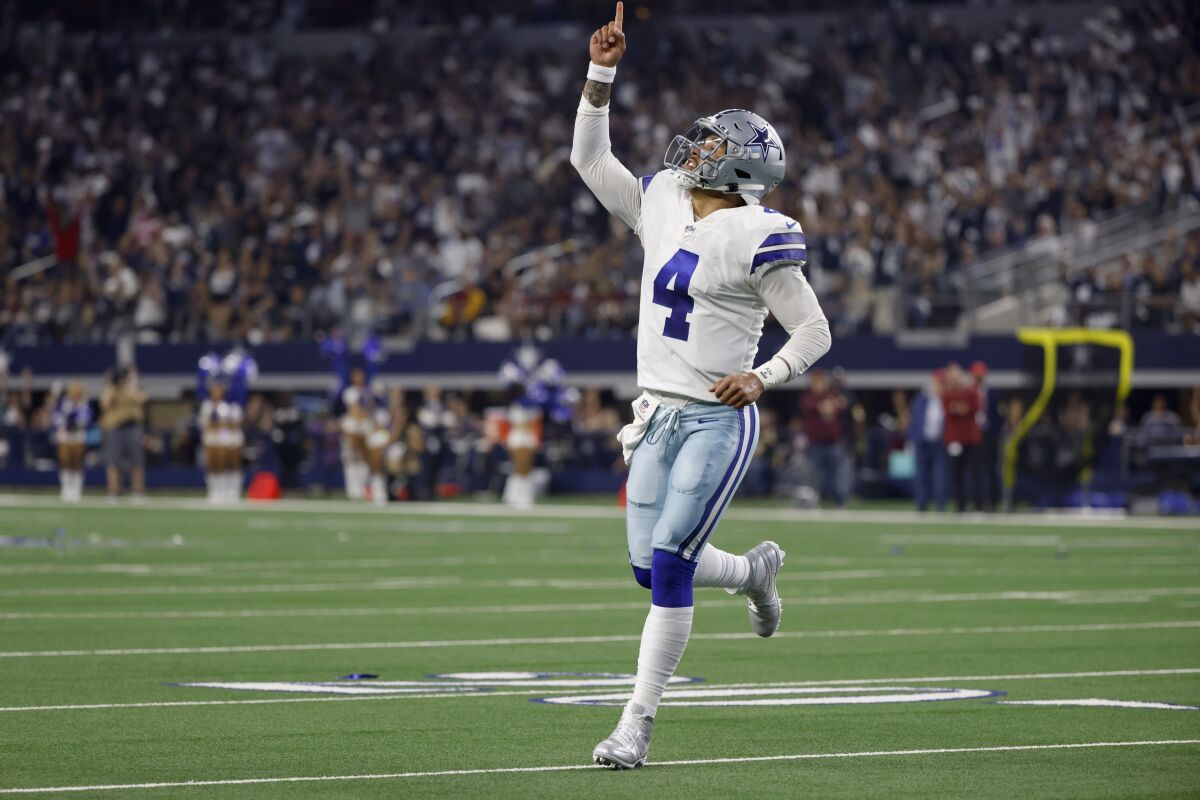 Dallas Cowboys quarterback Dak Prescott celebrates a touchdown against Washington.