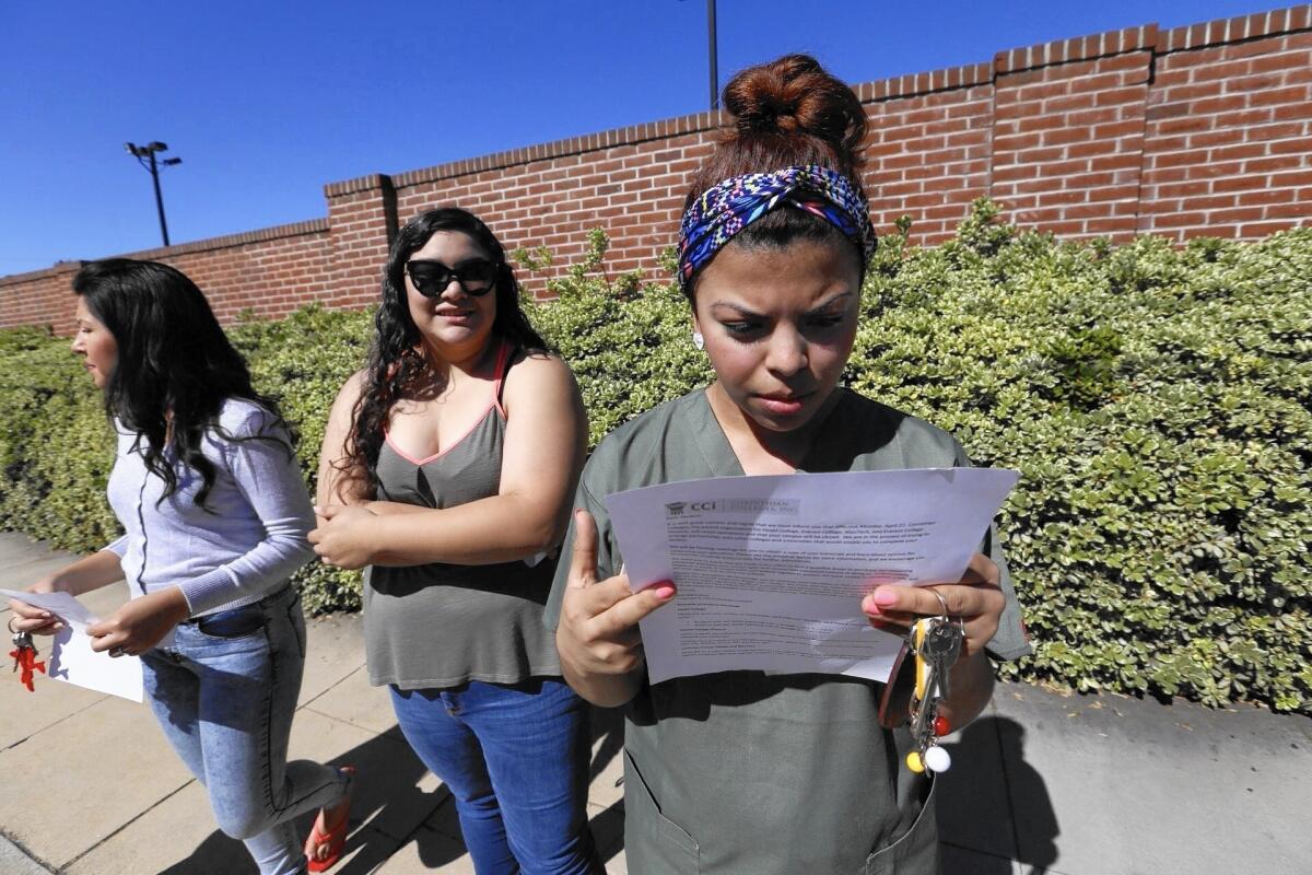 Ruby Maldanado, 20, a student at Everest College in Alhambra, reads a notice about the school's closure.