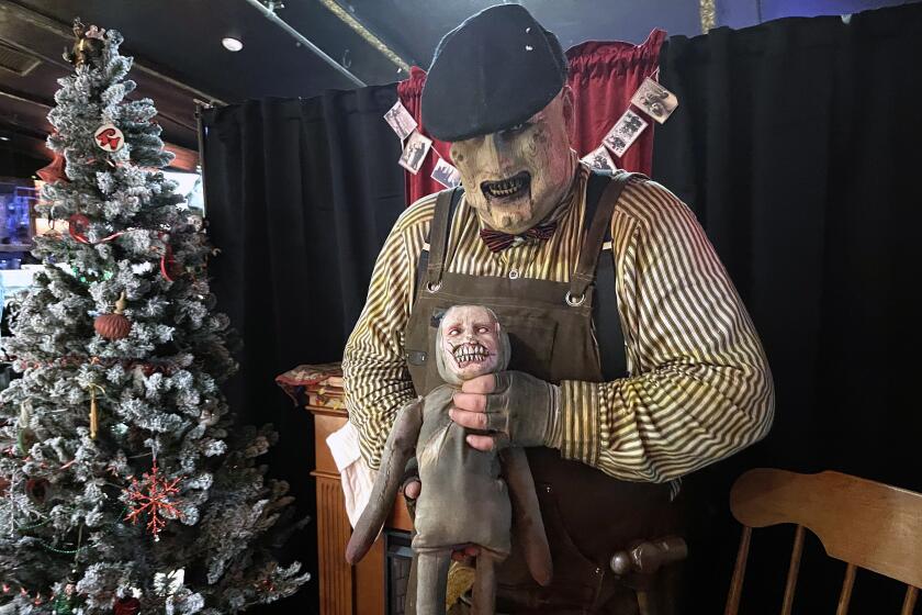 A ghoul greets revelers at a Krampus event put on by Witches Brew.