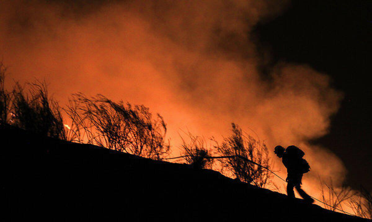 A firefighter battling the Powerhouse fire on Friday night.