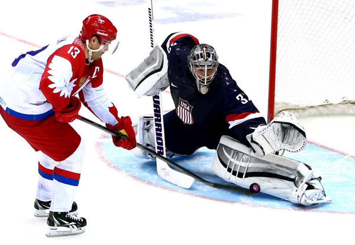 U.S. goaltender Jonathan Quick stops a shot by Russia's Pavel Datsyuk during the shootout in a preliminary-round game Saturday in the Sochi Olympics.