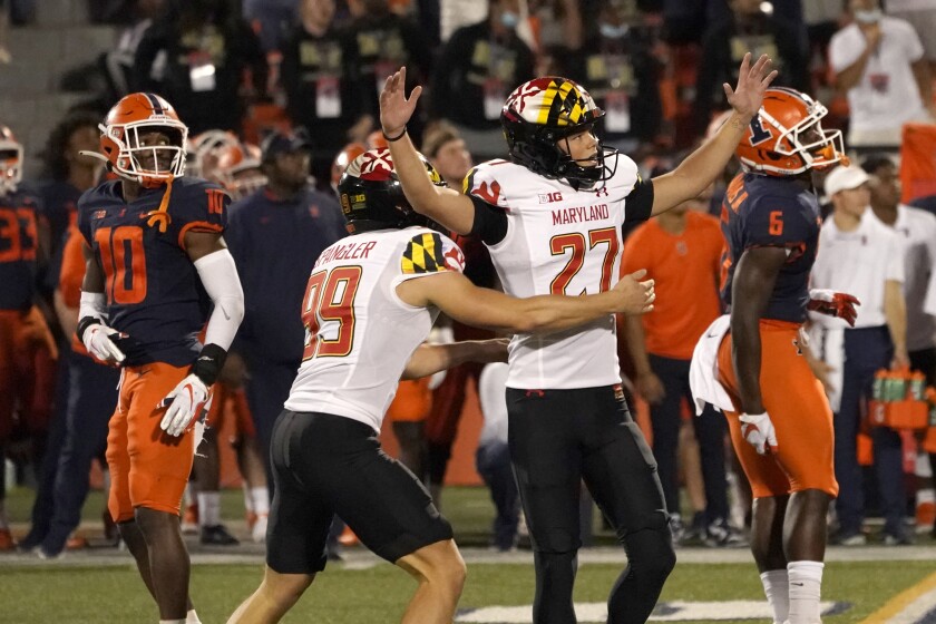 Maryland's Joseph Petrino (27) celebrates his game-winning field goal with holder Colton Spangler on Sept. 17, 2021.