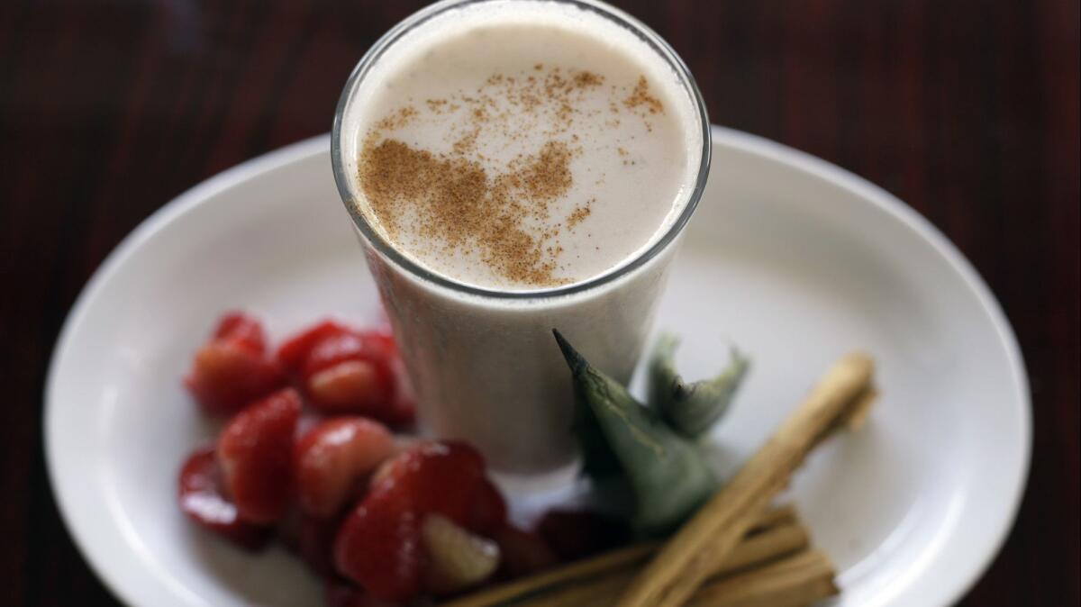 Pulque and strawberry drink.