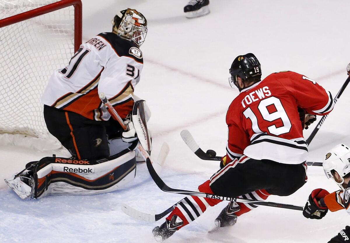 Ducks goalie Frederik Andersen deflects a shot by Blackhawks center Jonathan Toews in the first period of Game 6 on Wednesday.