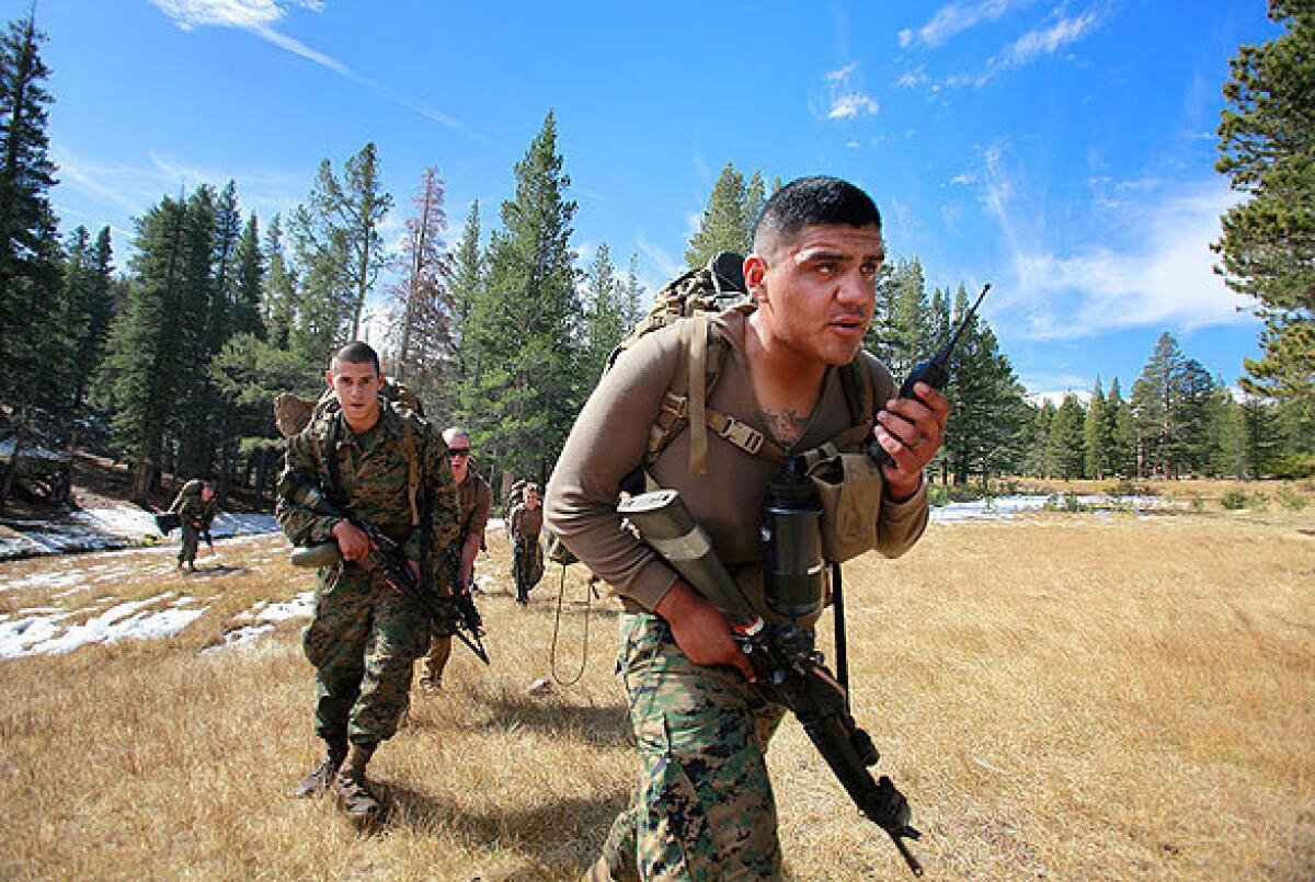 Marines head out on patrol during training exercises at the Marine Corps Mountain Warfare Training Center. The mountainous terrain prepares Marines for Afghanistan's cold, snowy winters, rugged landscape where communication is difficult and high altitudes where breathing is labored and the trajectory of bullets is difficult to gauge.