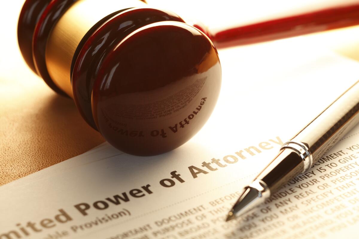 A gavel rests on a power of attorney document.