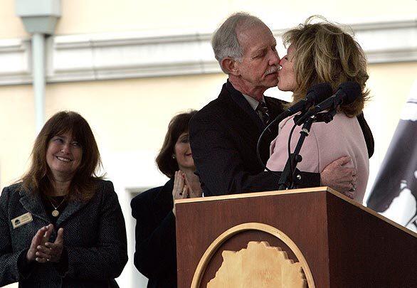 Capt. Chesley B. "Sully" Sullenberger III kisses his wife, Lorrie, after she introduced him during Saturday's celebration in Danville, Calif., where they live. He is the US Airways pilot who emergency-landed a passenger jet on New York's Hudson River recently. Everyone on board survived.