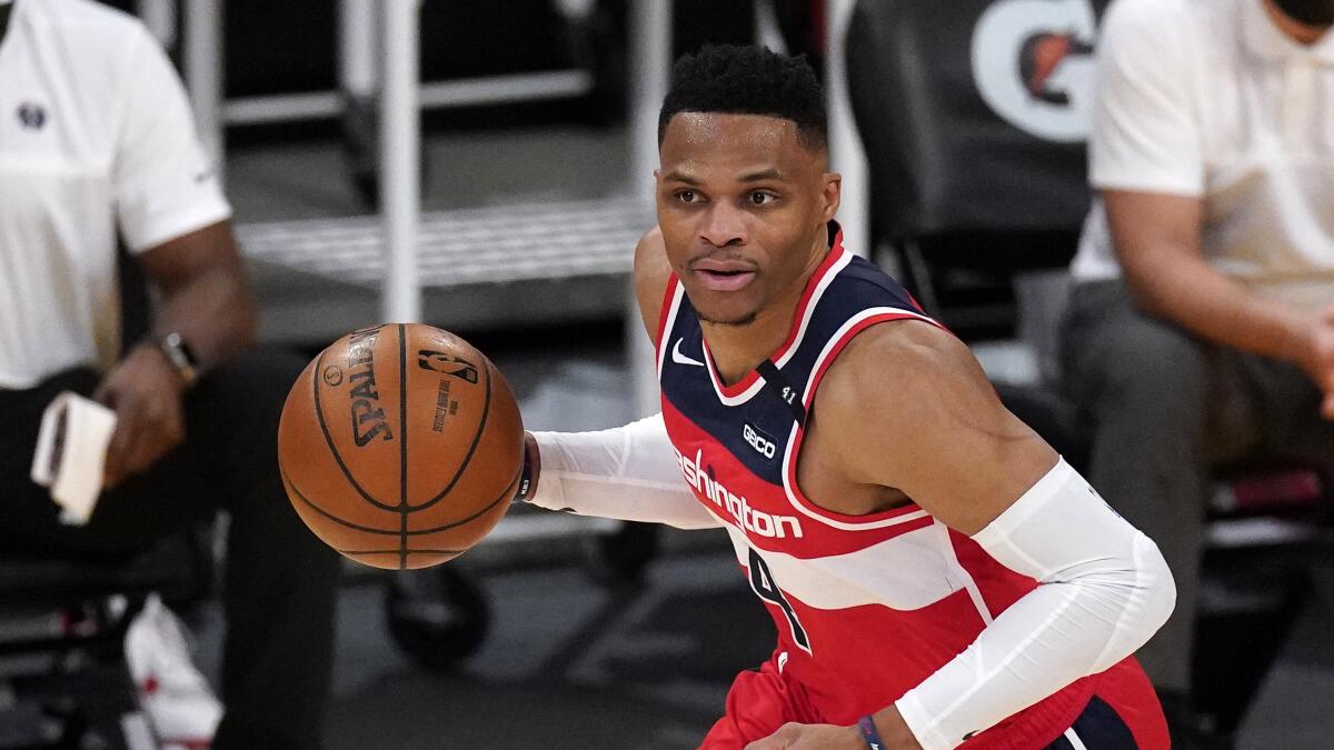Washington Wizards guard Russell Westbrook dribbles the ball