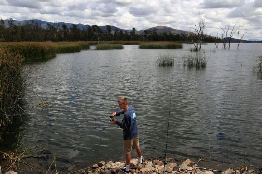 Derrick Dykes fishes for bass at Otay Lakes in Chula Vista 