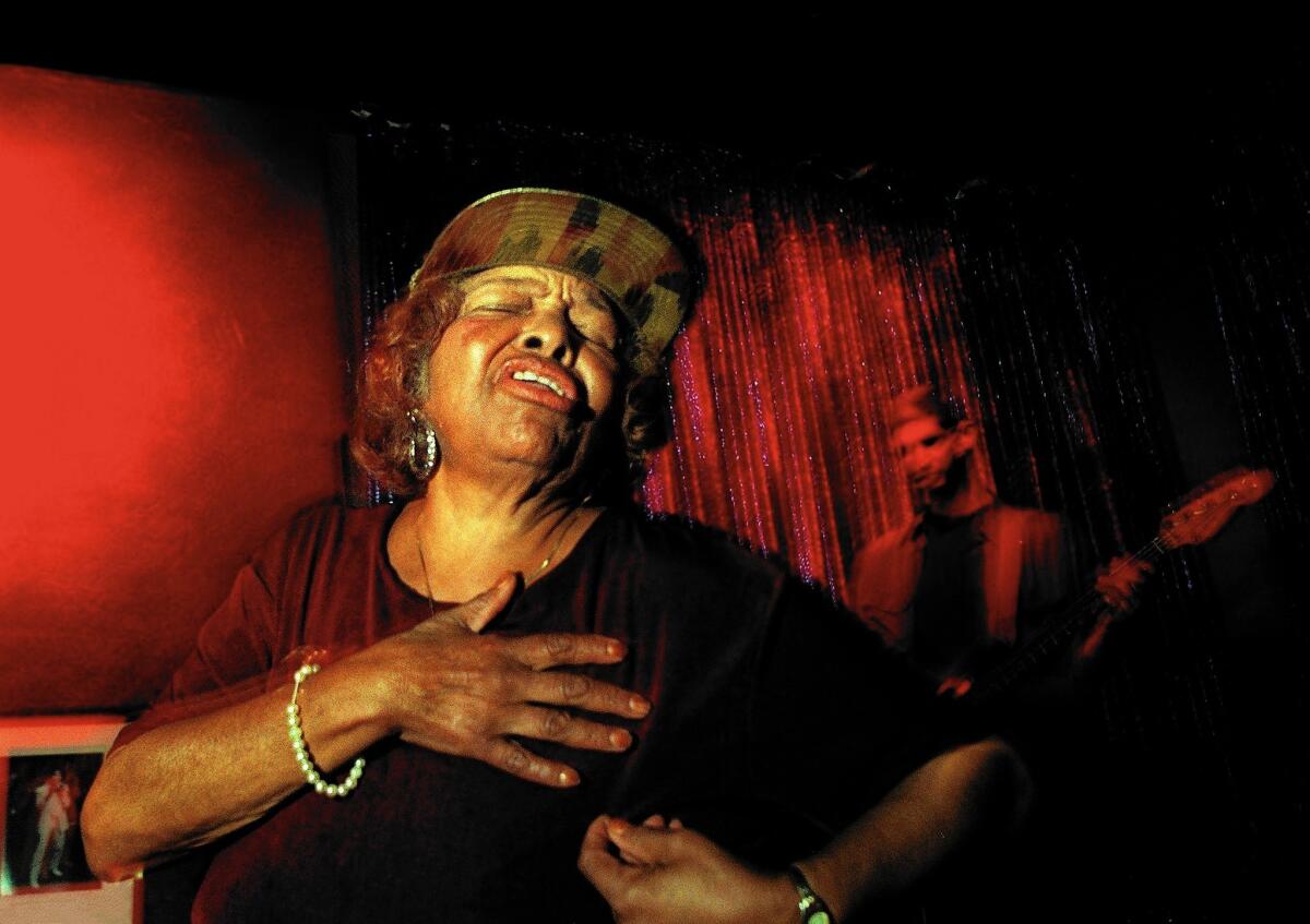 Longtime L.A. blues singer Mickey Champion performs without a microphone — she didn't need one — at Babe's and Ricky's Inn in Leimert Park in 1998.