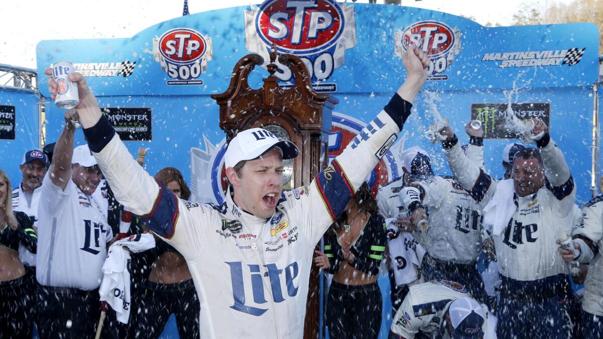 Brad Keselowski celebrates after winning the Monster Energy NASCAR Cup Series race at Martinsville Speedway on Sunday.