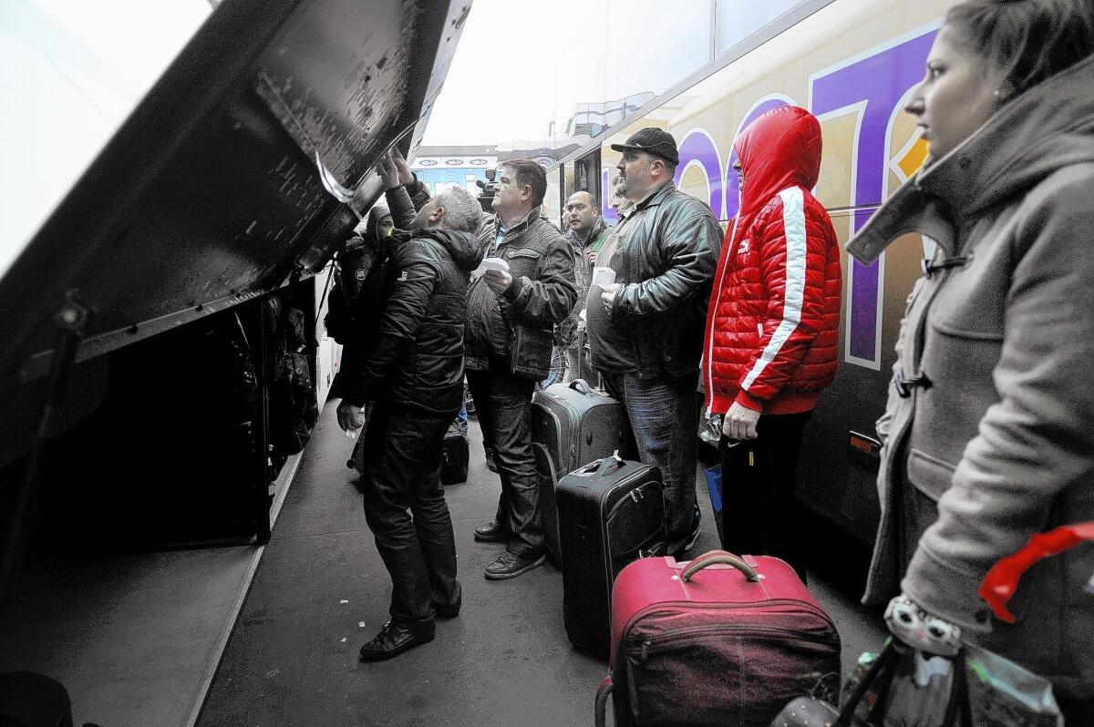 Passengers wait to board a bus Jan. 2 in Sofia, Bulgaria, bound for London via Germany and France. Since the start of the year, Romanians and Bulgarians have been permitted to live and work in any European Union country, but many say they have encountered discrimination.