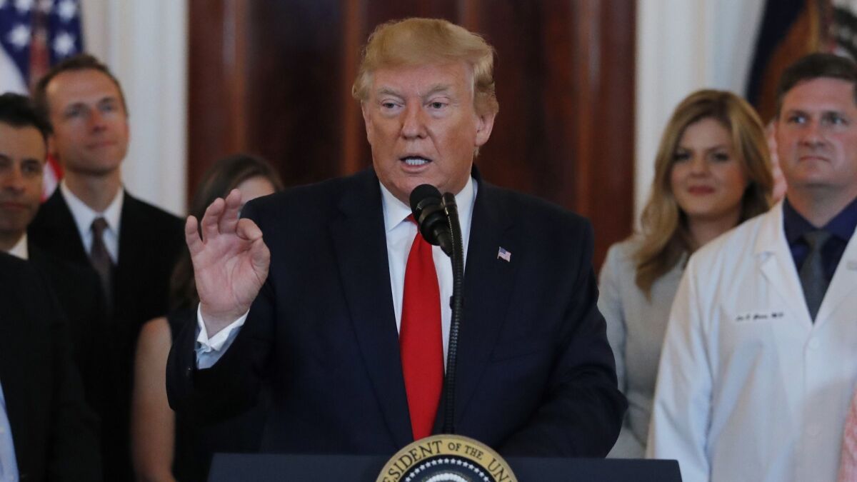 President Trump speaks during a ceremony at the White House on Monday before signing an executive order that calls for upfront disclosure by hospitals of actual prices for common tests and procedures to keep costs down.