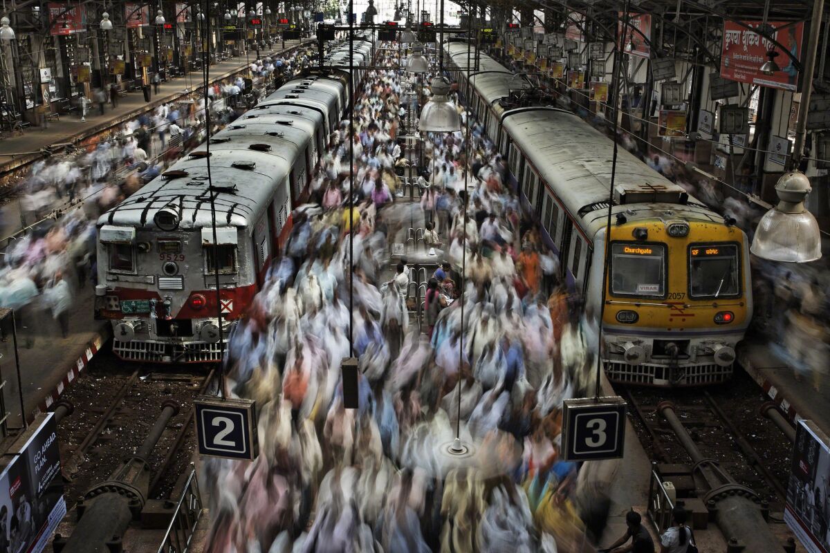 Travelers pack Churchgate Railway Station in Mumbai, India. Mumbai is among the cities worldwide where a population explosion is forecast to take place between 2025 and 2050, according to one report.