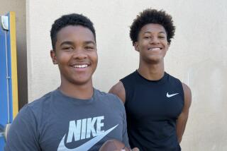 Sophomore quarterback Kingston Tisdell and junior receiver/cornerback Peyton Waters.