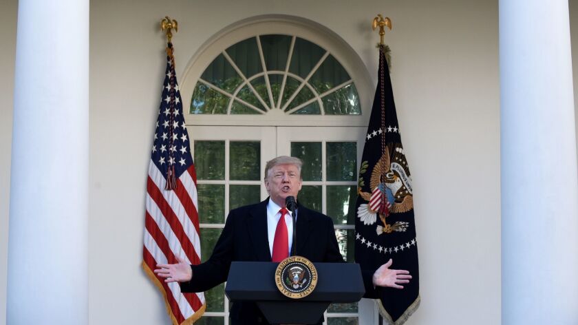 President Trump speaks in the Rose Garden in Washington on Jan. 25.