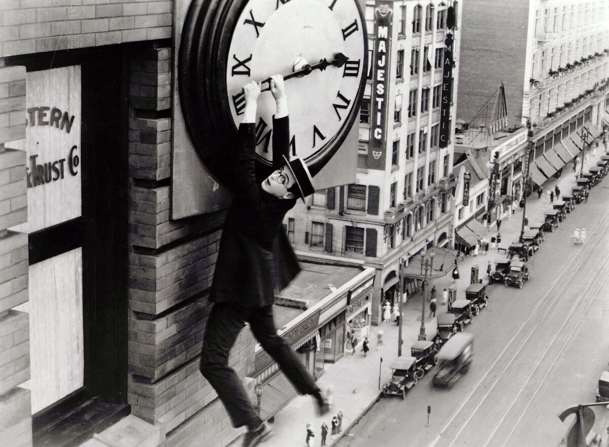 Actor Harold Lloyd hangs from a clock in a famous image from his 1923 "Safety Last!" romantic comedy.