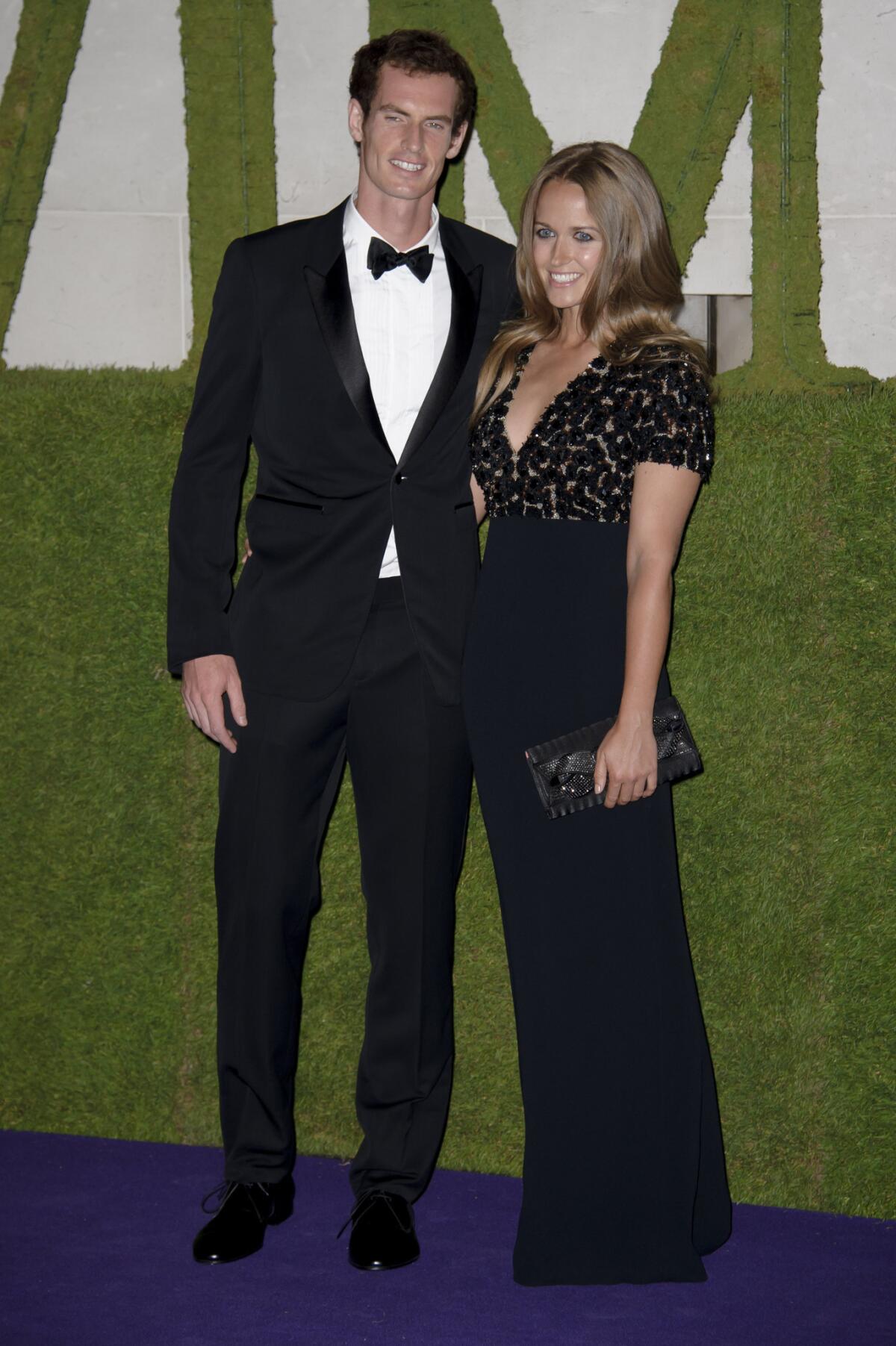 Andy Murray and Kim Sears wear Burberry as they arrive for the Wimbledon Champions' Dinner in London on Sunday.