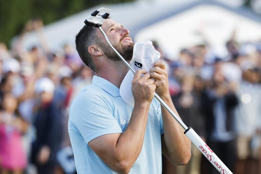 LOS ANGELES, CA - JUNE 18: Wyndham Clark celebrates on the 18th green after winning the US Open.