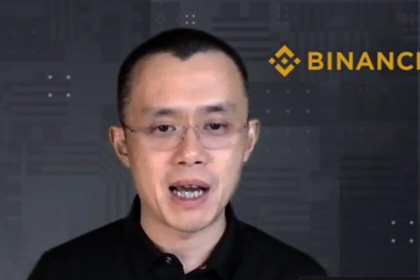 FILE - Binance CEO Changpeng Zhao answers a question during a Zoom meeting interview with The Associated Press on Nov. 16, 2021. Binance, the world’s largest cryptocurrency exchange, has agreed to pay more than $4 billion as part of an agreement with the U.S. government, a person familiar with the agreement told The Associated Press on Tuesday, Nov. 21, 2023. (AP Photo/File)