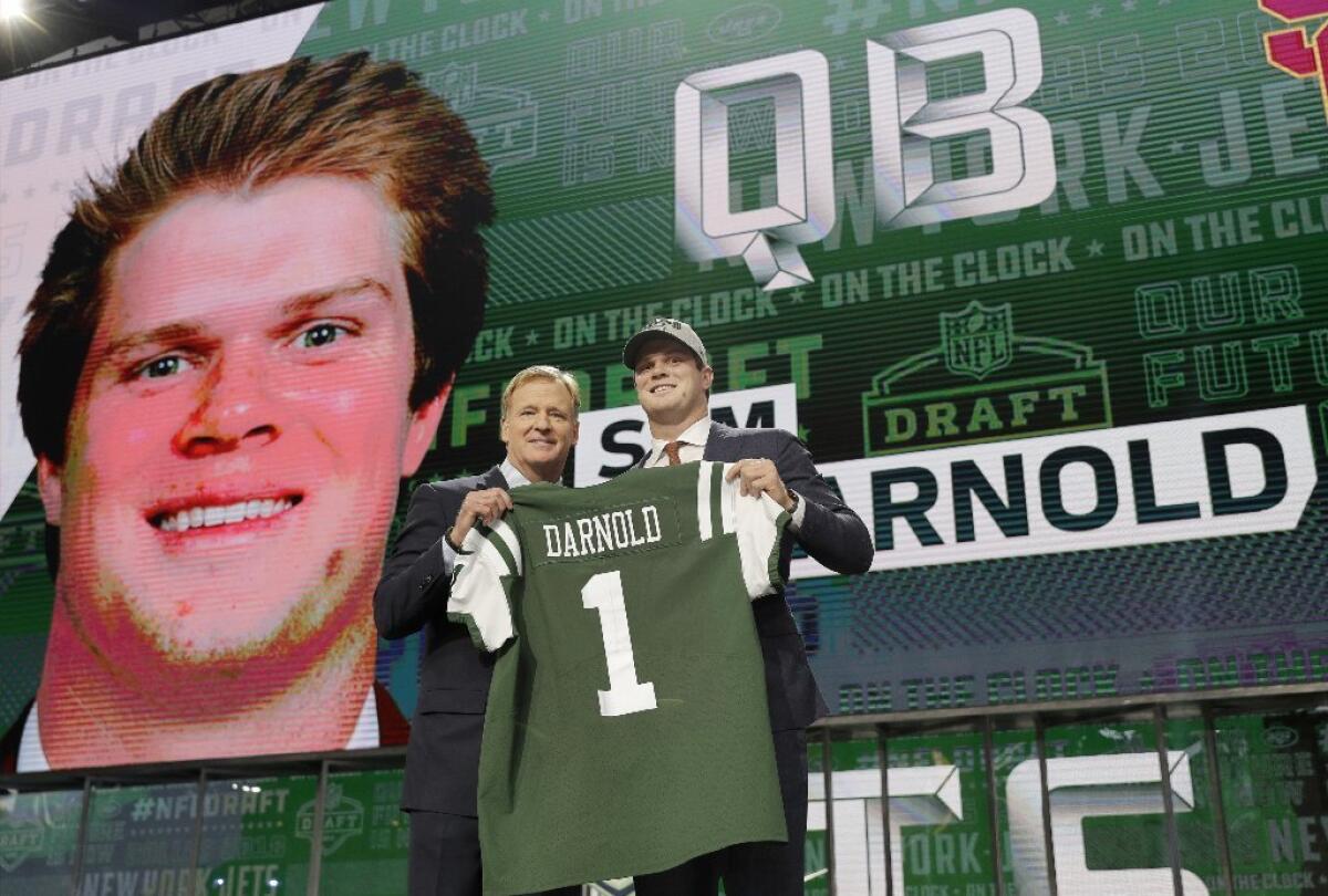 USC's Sam Darnold, right, poses for photos with commissioner Roger Goodell after being selected No. 3 overall by the New York Jets.