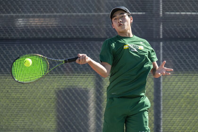 Huntington Beach, CA - March 30: Edison's Dylan Trinh hits a forehand in a match against Huntington Beach during a Wave League game on Thursday, March 30, 2023 in Huntington Beach, CA. (Scott Smeltzer / Daily Pilot)