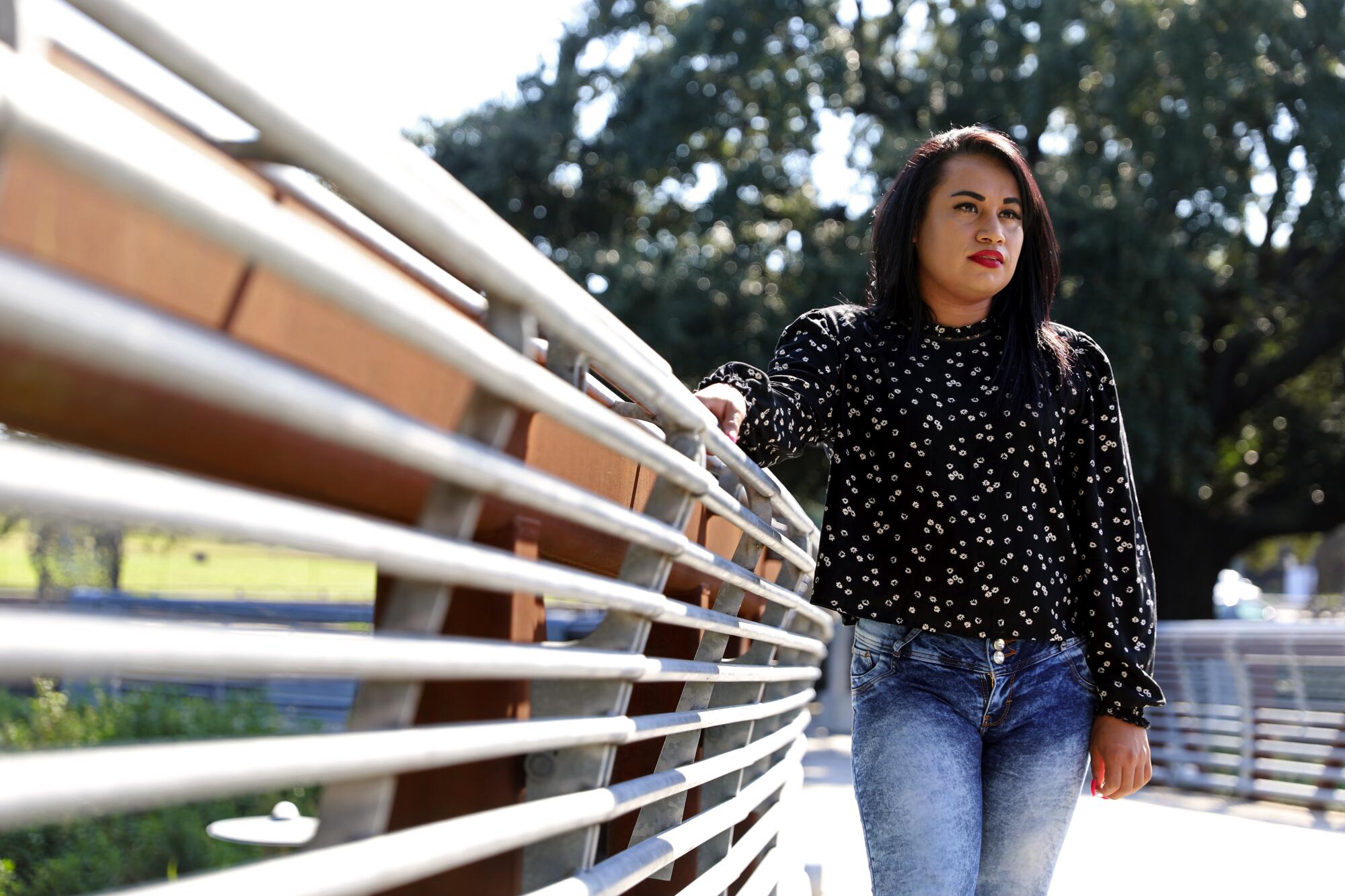 Mayela Villegas stands on a bridge in the Houston area.