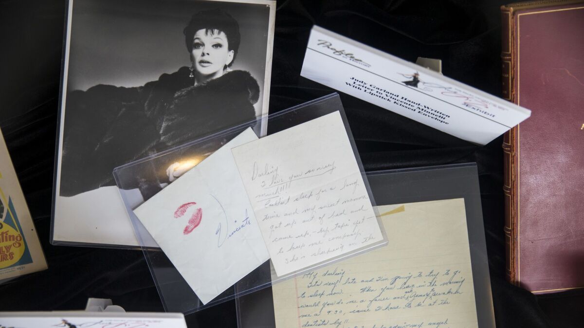 A photograph of Judy Garland and a handwritten note from Garland to Vincente Minnelli on display at the Paley Center for Media's pre-auction display of family and personal items owned by Liza Minnelli.