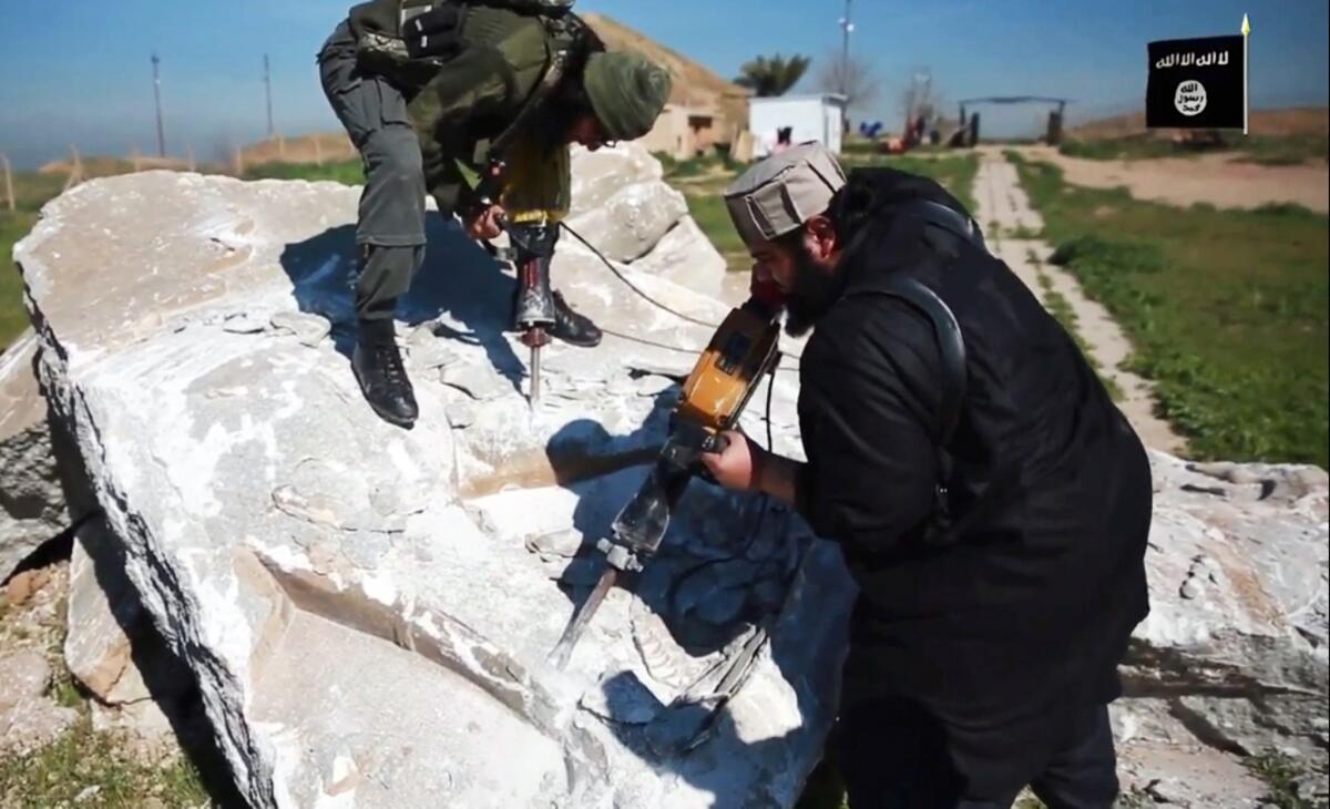An undated video is said to show Islamic State members destroying parts of a frieze at the ancient Iraqi city of Nimrud.