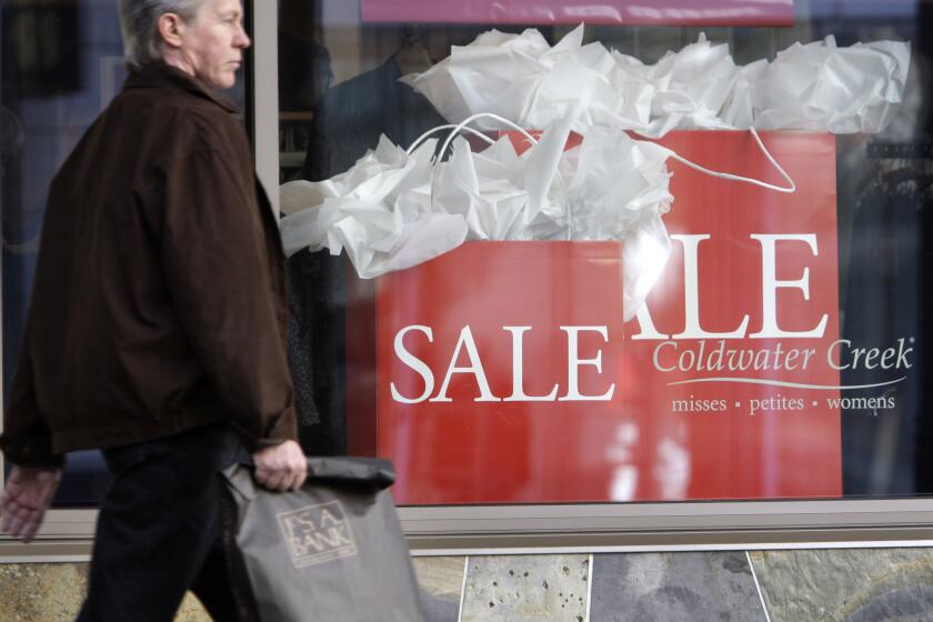 A shopper walks past a Coldwater Creek store in downtown Seattle.