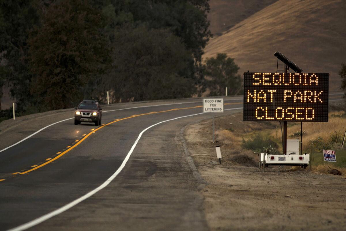 A sign warns motorists of the closure of Sequoia National Park as the KNP Complex fire threatens the area