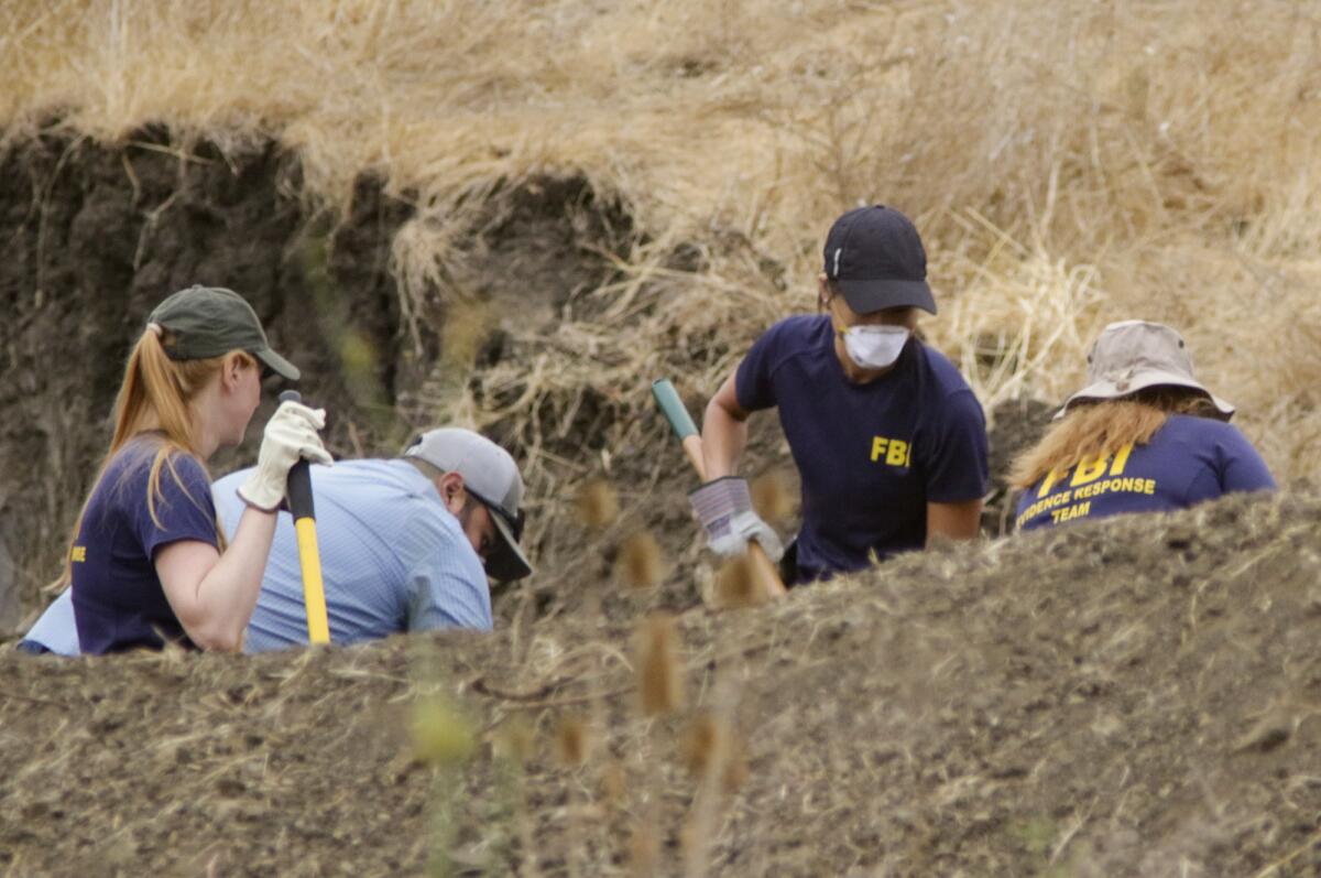 A team of FBI agents and San Luis Obispo County sheriff's deputies excavates a hillside above Cal Poly as part of the investigation into the disappearance of student Kristin Smart two decades ago.