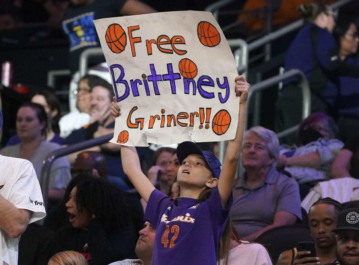 A young Phoenix Mercury fan holds up a "Free Brittney Griner" sign during a game against the Las Vegas Aces on May 6.
