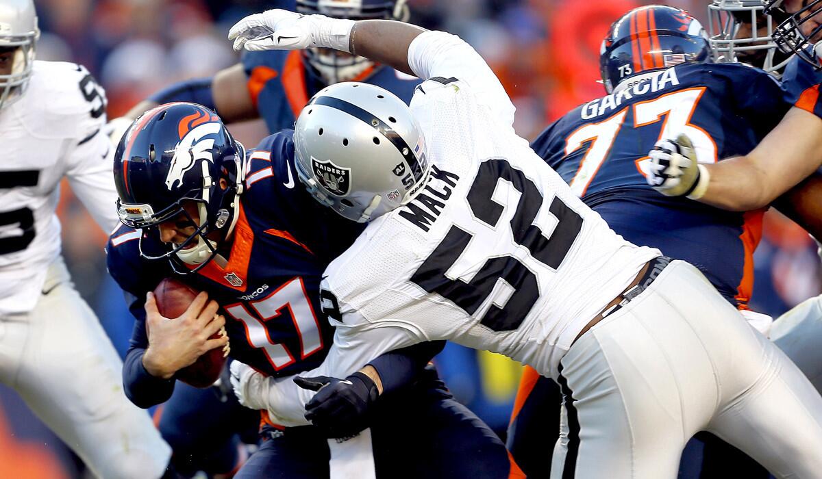Denver Broncos quarterback Brock Osweiler is sacked by Oakland Raiders defensive end Khalil Mack during the second half on Sunday.