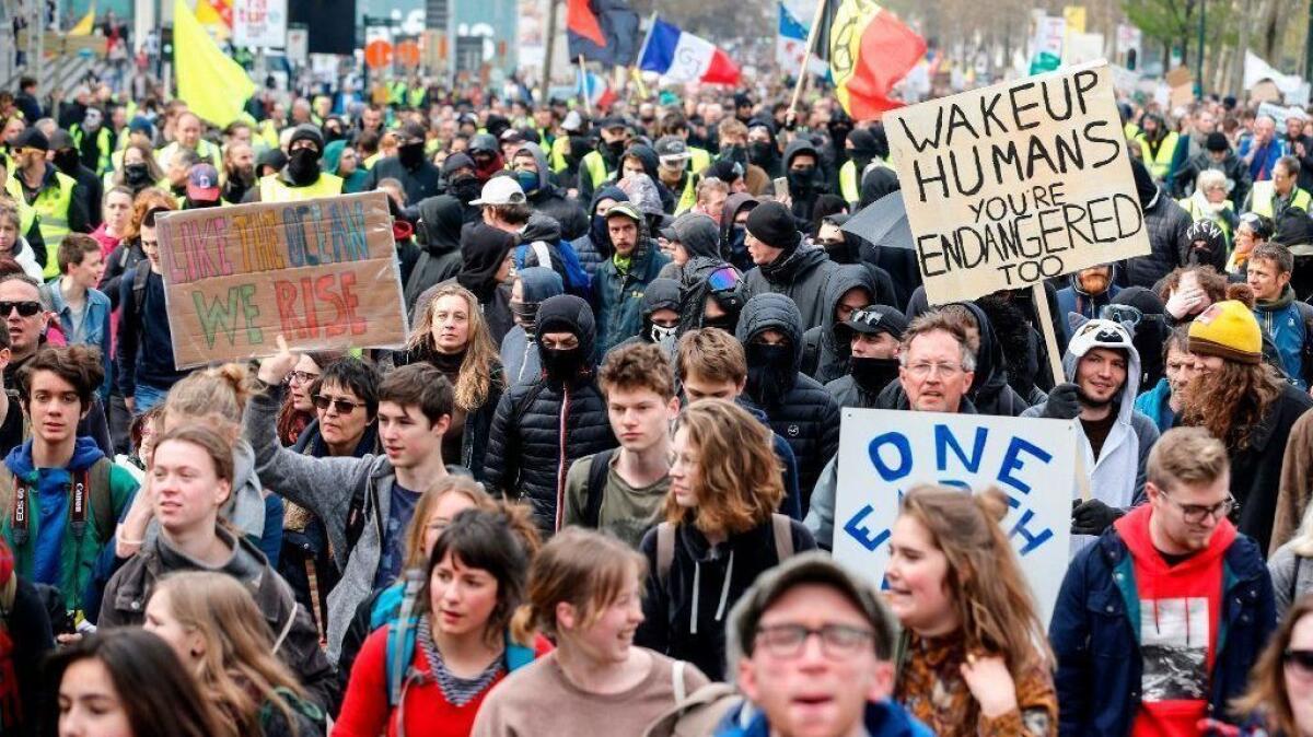 Marchers push for action against climate change in Brussels on March 31.