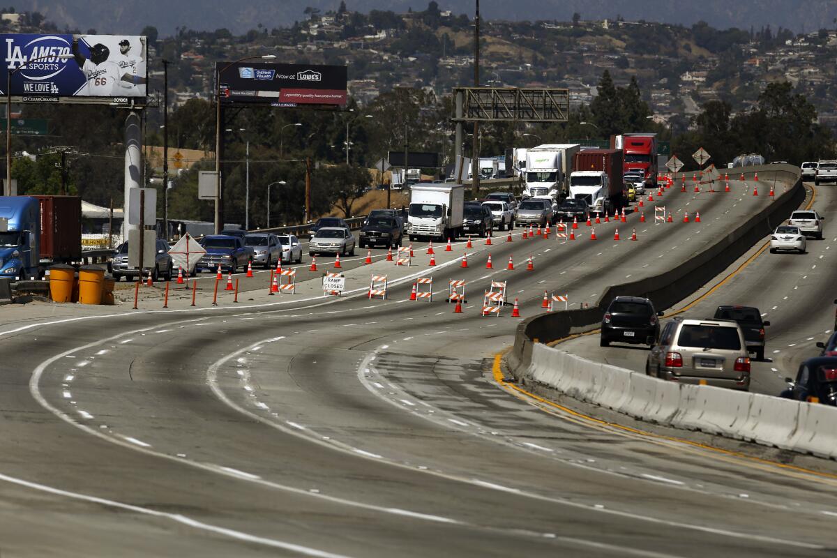 Southbound traffic is diverted off the 710 freeway as workers repair a large section just south of Interstate 5.