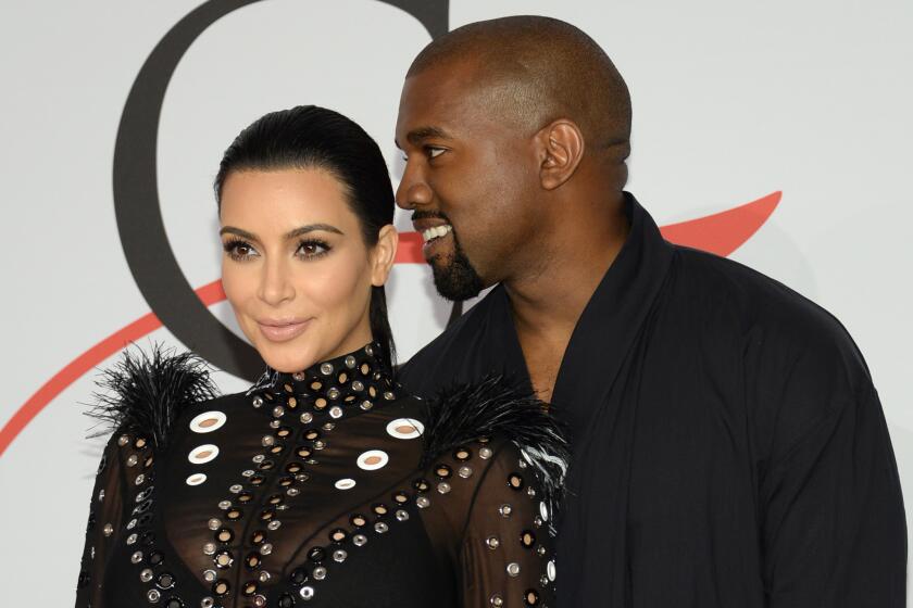 Kim Kardashian and Kanye West arrive at the CFDA Fashion Awards in New York on June 1.